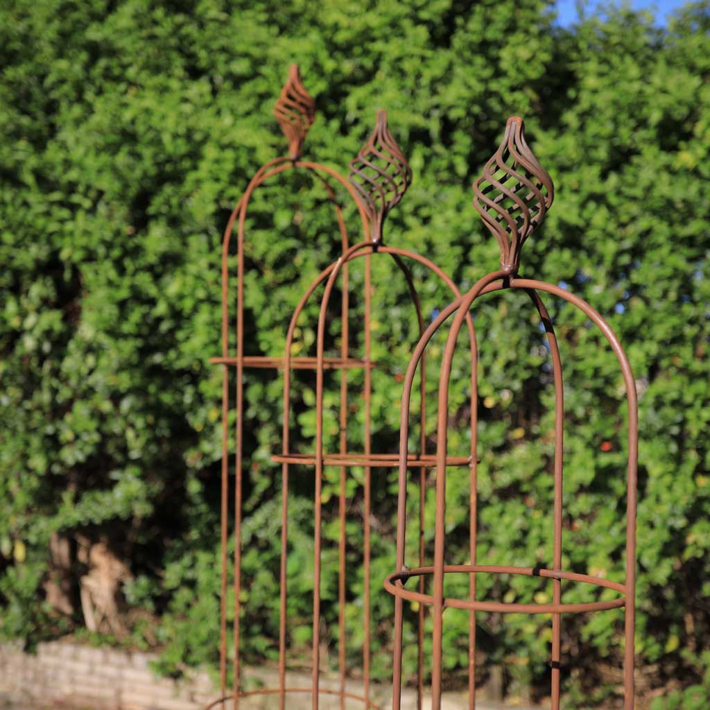 rustic metal obelisk in garden